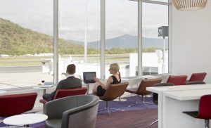 The new Virgin Australia lounge in Cairns offers panoramic views over the runway and surrounding hills.