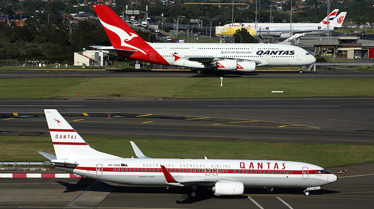A Qantas Boeing 737-800 and Airbus A380 at Sydney Airport. (Rob Finlayson)