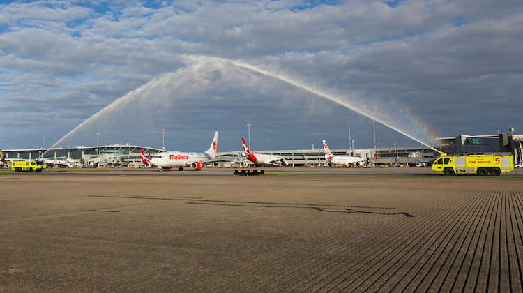 Airservices Aviation Rescue and Fire Fighting monitor cross greet Malindo Air at Brisbane. (Lance Broad)