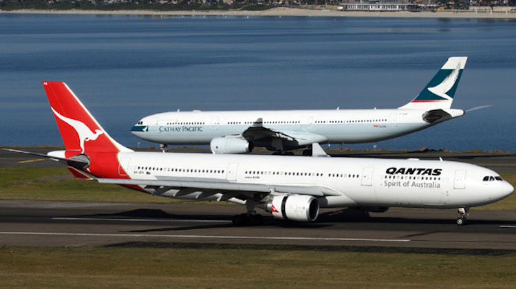 A pair of Airbus A330s from Cathay Pacific and Qantas at Sydney Airport. (Rob Finlayson)