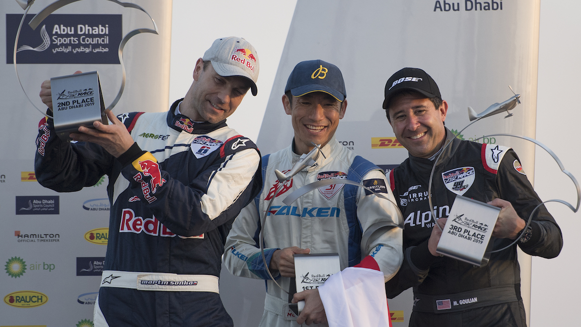 Yoshihide Muroya of Japan (C) celebrates with Martin Sonka of the Czech Republic (L) and Michael Goulian of the United States (R). (Red Bull Content Pool)