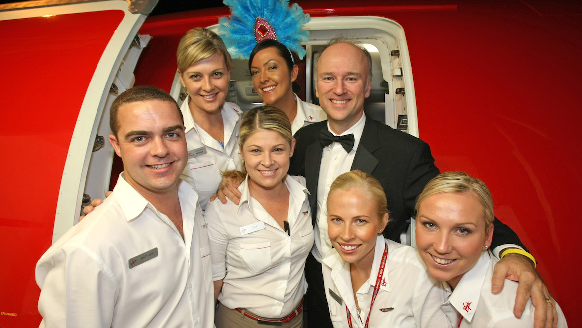 Brett Godfrey with Virgin Blue flight attendants at the September 2007 launch of Canberra-Sydney E-Jet flights. (Paul Sadler)