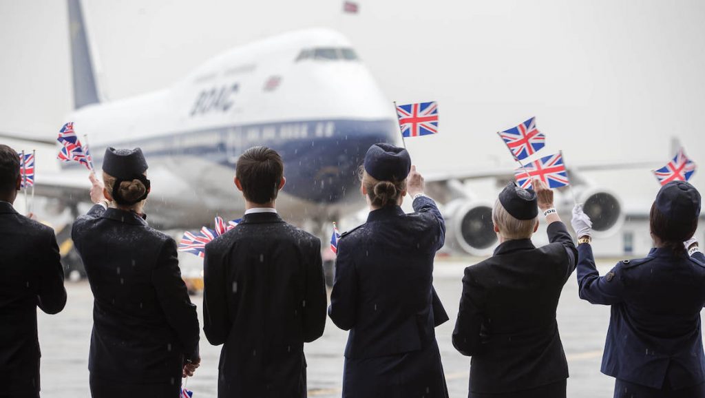 British Airways staff welcomes the arrival of a Boeing 747-400 painted in BOAC livery. (British Airways/Stuart Bailey)