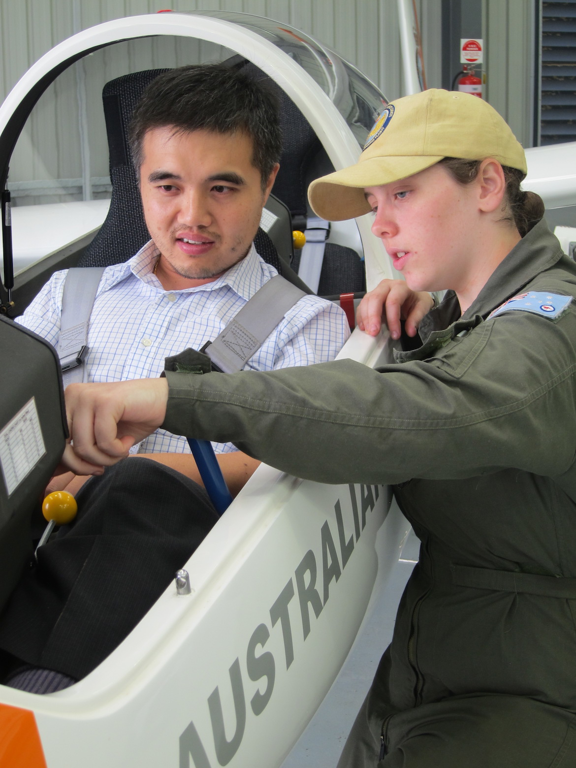 Cadet Flight Sergeant Stephanie Ehret gives Australian Aviation some instruction on the glider’s instrument panel. (Australian Aviation)