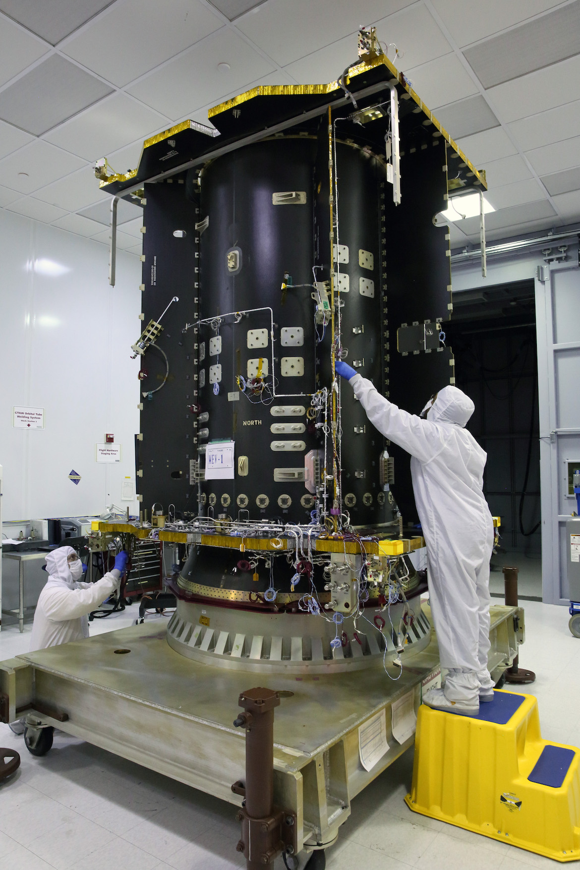 Orbital ATK specialists at work on the core of the MEV. (Northrop Grumman)
