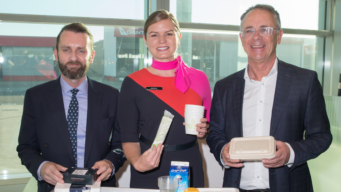 Qantas's Andrew Parker, crew member Maddy Rowcliff and Andrew David ahead of the airline's "zero waste" flight. (Qantas)