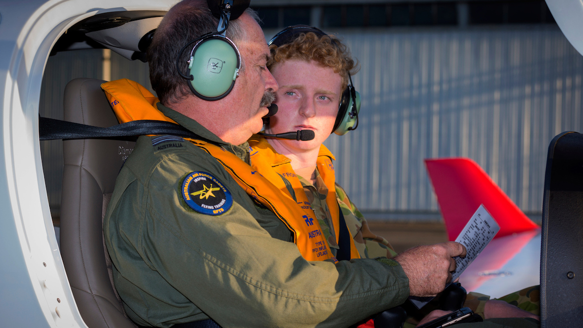 Head of Operations, Australian Air Force Cadets Elementary Flying Training School, SQN Leader Gary Presneill, debriefs 15-year-old Leading Cadet Jorden Misseos after his first flight in the new Diamond DA40 NG at RAAF Base East Sale. (Defence, CPL Nicci Freeman)