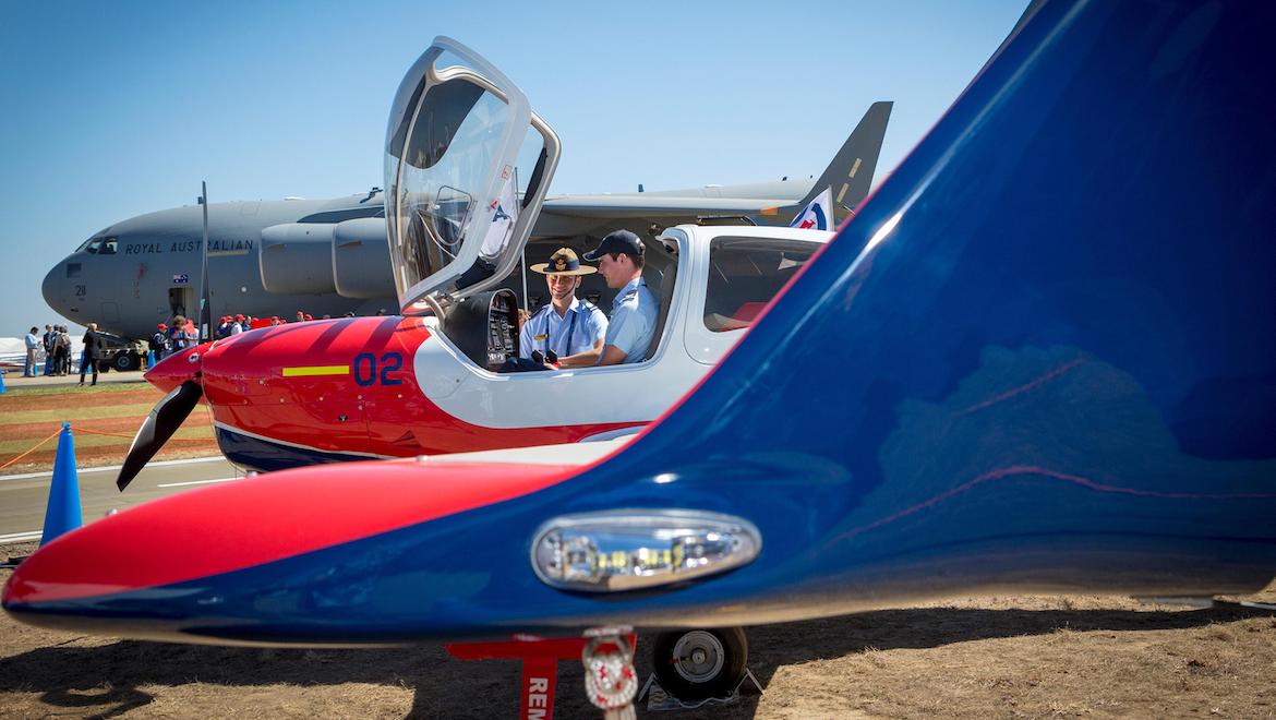 Cadet Warrant Officer (AAFC) Guy St Leon from No. 418 SQN (left), and Cadet Corporal Trent Buckner from No. 405 SQN take in the Diamond DA40 NG at the Australian International Airshow, Avalon. (Defence, CPL Nicci Freeman)