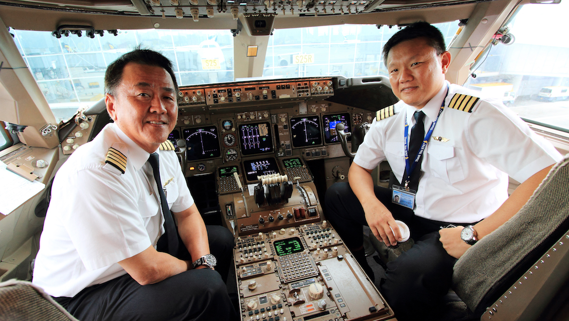 Captains F H Yeap and Gerard Ee flew the historic SQ747 from Singapore to Hong Kong. (SIA)