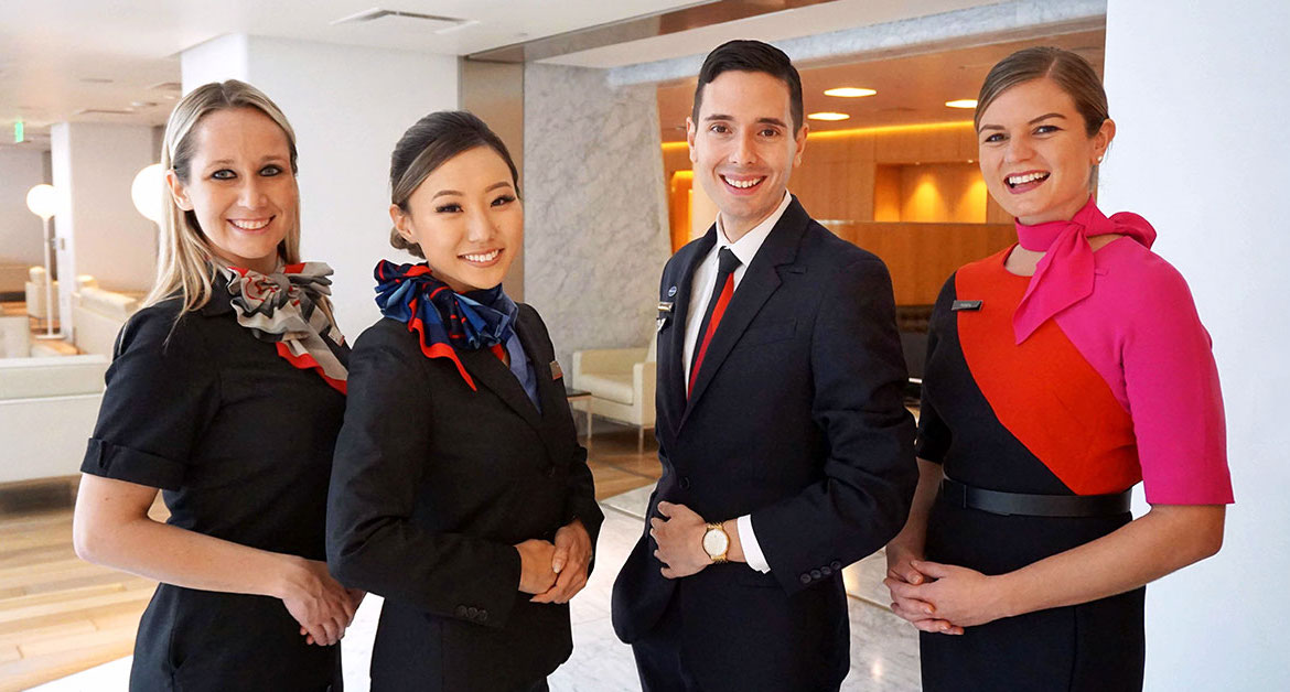 American Airlines and Qantas staff pose for a photo. (American Airlines)