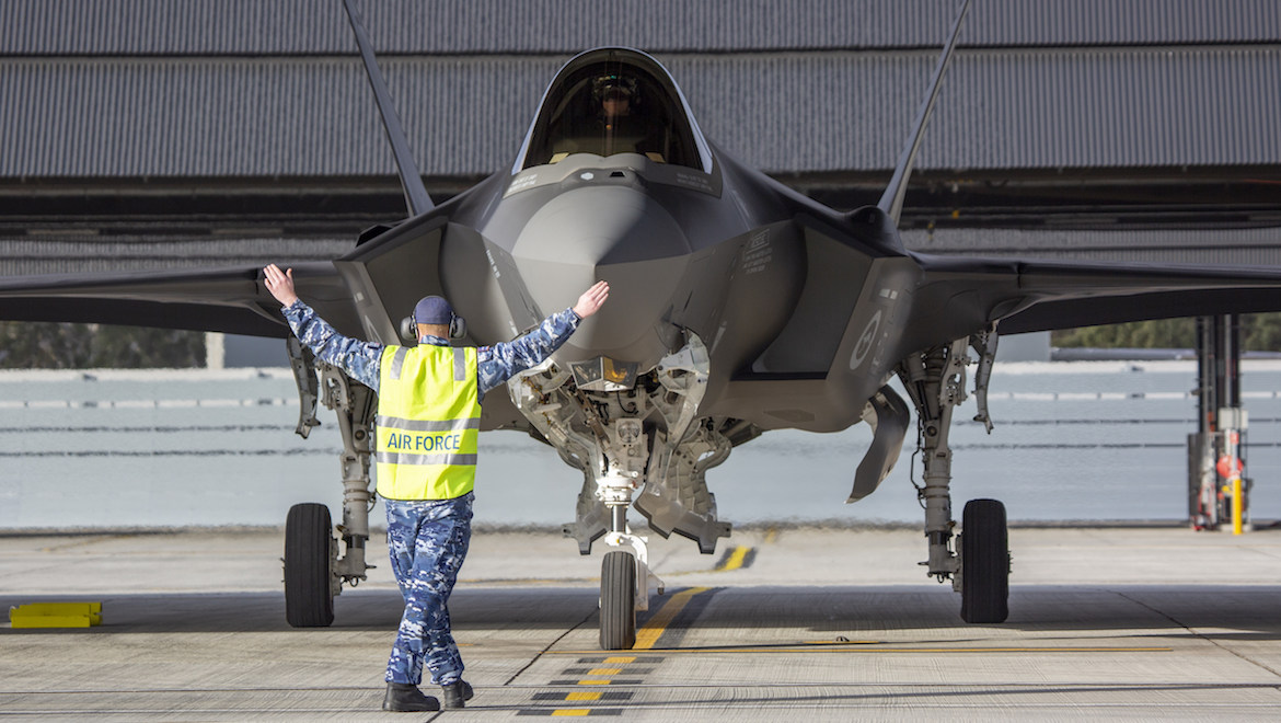 The RAAF's newest F-35A Lightning II aircraft A35-016 is marshalled into position at No. 3 Squadron at RAAF Base Williamtown. (Defence)