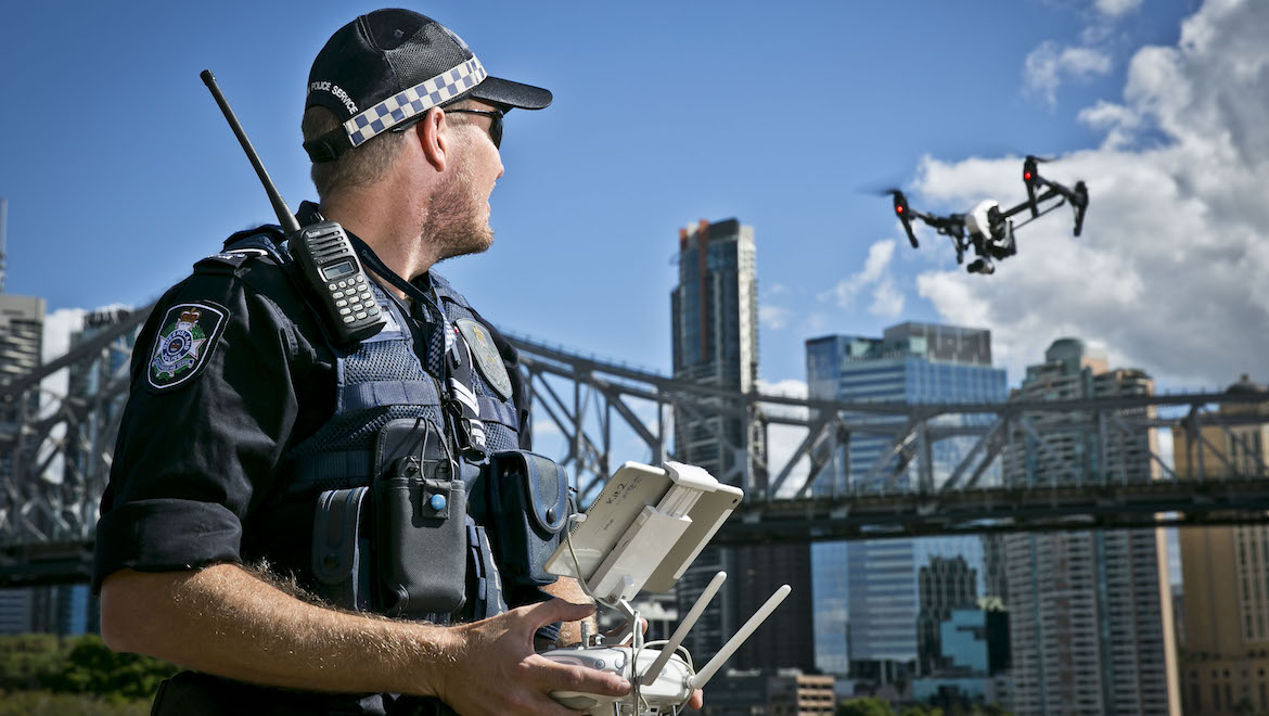 Queensland Police's PolAir chief pilot Sergeant Rob Whittle operates a drone in Brisbane. (Queensland Police)