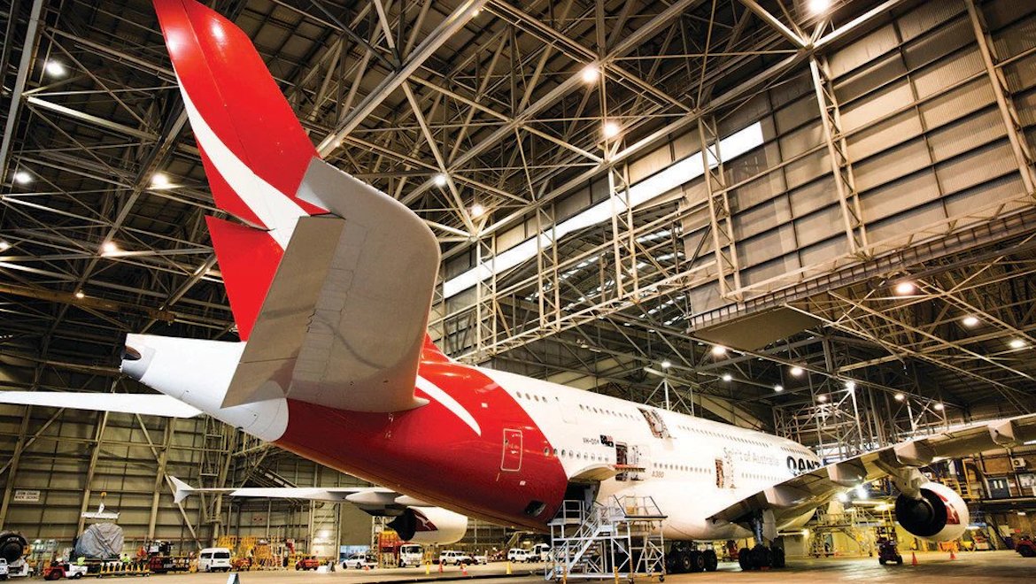 A Qantas Airbus A380 undergoes engineering work in the hangar. (Qantas)