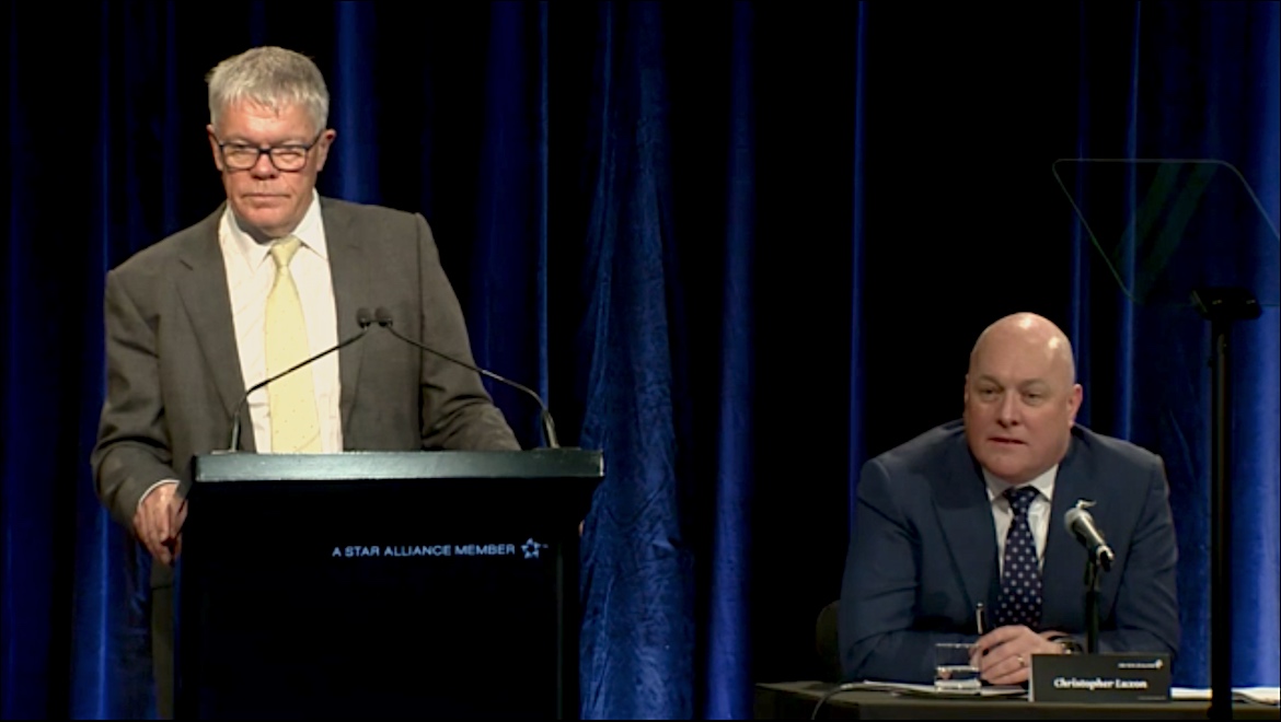 A screenshot of Air New Zealand chairman Tony Carter (standing) and chief executive Christopher Luxon at the company's annual general meeting. (Air New Zealand webcast)