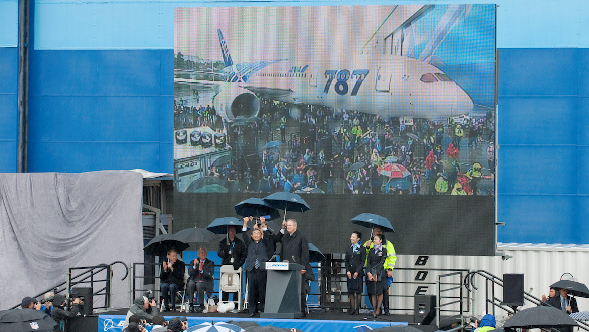 ANA chief executive Shinichiro Ito holds up the ceremonial key presented to him by Boeing Commercial Airplanes president James Albaugh at the 787 delivery ceremony. (Boeing)