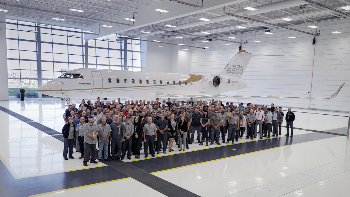 Bombardier employees in front of a Global 6500. (Bombardier)